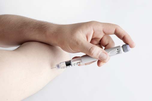 man taking insulin on hands=