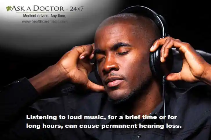  man listening music  over headphones =